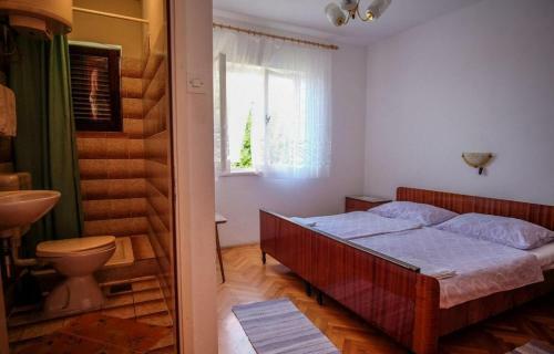 Apartments With A Parking Space Barbat (rab) - 14431