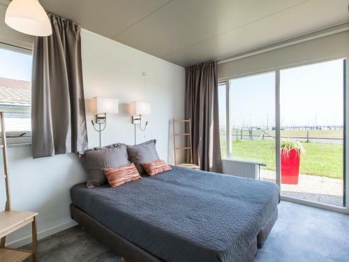 Striking Holiday Home In Kamperland With Marina Views