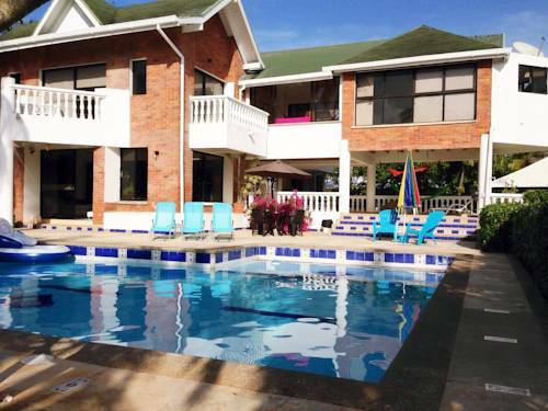 Hostal Casa De Las Flores Tropical Lodge