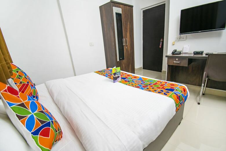 Fabhotel Purple Orchid