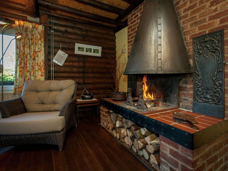 Open Wooden Chalet Built Against A Hill