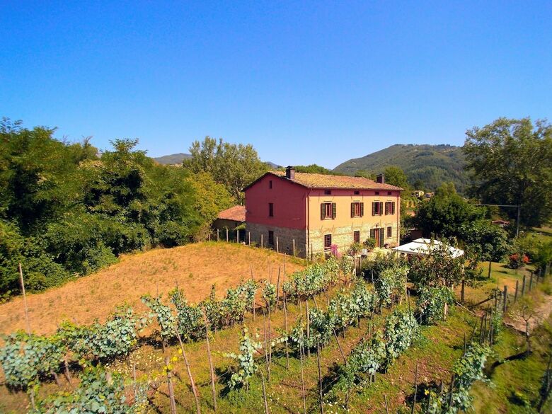 A Nice Rural House Surrounded By Hills And Fields