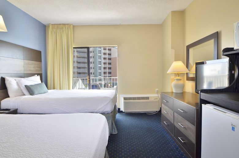 Apartamento Coastal Palms Inn & Suites