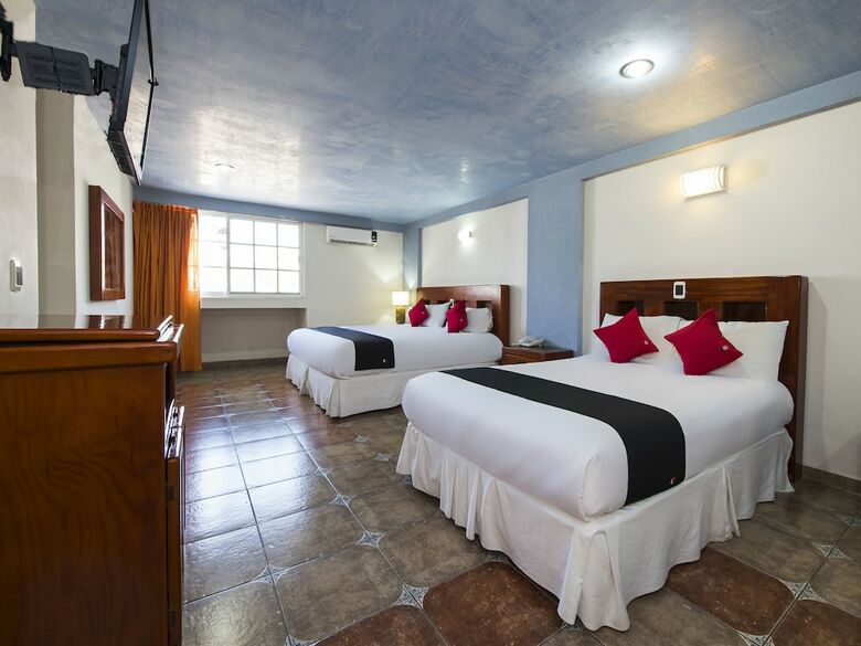 Hotel Capital O Suites de Reyes