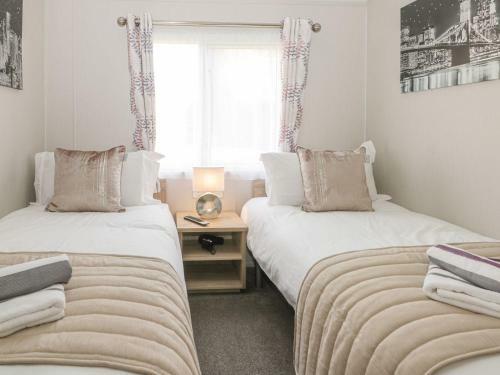 Stylish Lodge Set In The Sand Le Mere Holiday Park