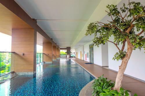 Comfortable Studio Room At Capitol Suites Apartment By Travelio