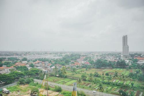 Minimalist 2br At Emerald Bintaro Apartment By Travelio