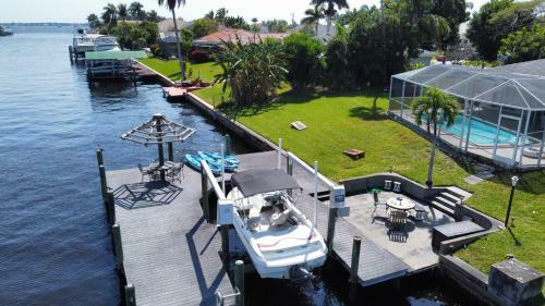 Canal-front Getaway With Heated Pool & Dock Home