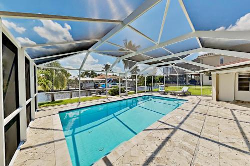 Chic Canal-front Home - Heated Pool, Private Dock Home