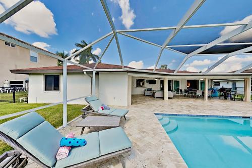 Chic Canal-front Home - Heated Pool, Private Dock Home