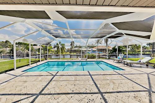Chic Canal-front Home - Heated Pool, Private Dock Home