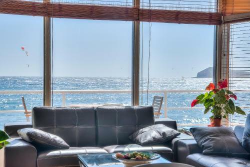 House Touching The Sea