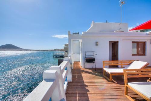 House Touching The Sea