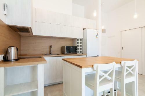 White Sand Apartment With A Balcony, By Cohost