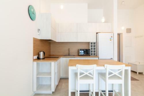 White Sand Apartment With A Balcony, By Cohost