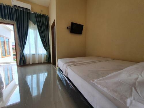 Hotel Oyo 90945 Arizon Kost