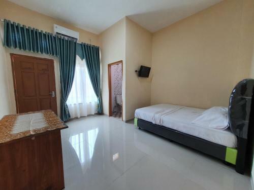 Hotel Oyo 90945 Arizon Kost