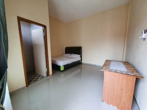 Hotel Oyo 90945 Arizon Kost