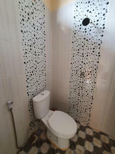 Hotel Oyo 90945 Arizon Kost