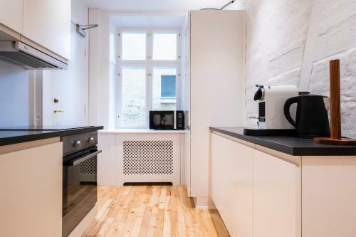 By Town Hall Apartments - Into This Place
