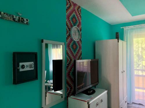 �va Apartman, Helikon-liget
