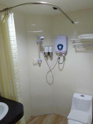 Oyo 90464 Borneo Suites Hotel