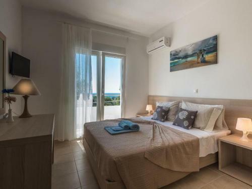 Posh Holiday Home In Gennadi With Shared Swimming Pool