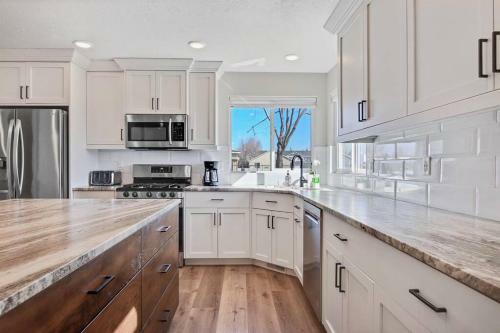 The White Custom Farmhouse 5 Bedroom Home