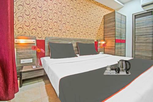 Capital O 91036 Hotel Stanza