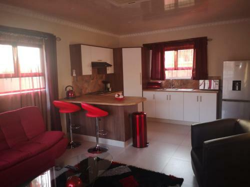 The Log Cabin Apartments Hotel
