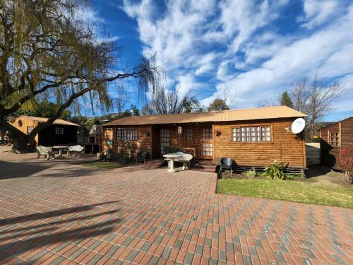 The Log Cabin Apartments Hotel