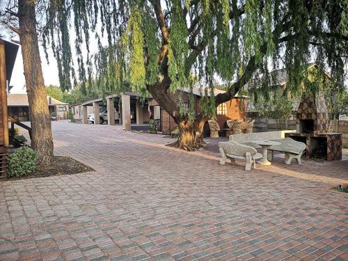 The Log Cabin Apartments Hotel