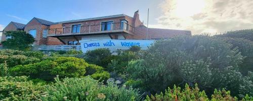 Hostal Dances With Waves