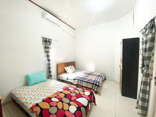 Hostal Homey Guesthouse Kertajaya (syariah)