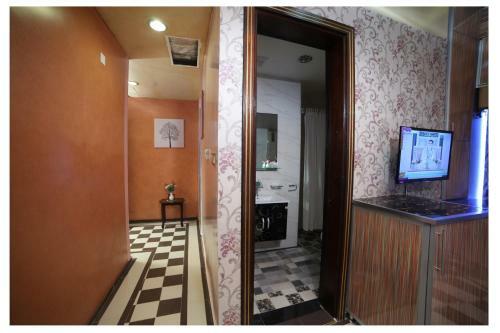 Apartamento Roomi Suites Hotel