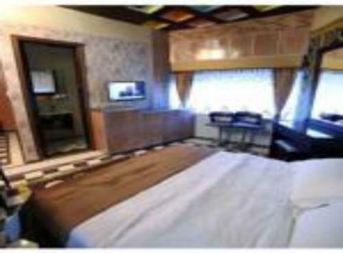 Apartamento Roomi Suites Hotel