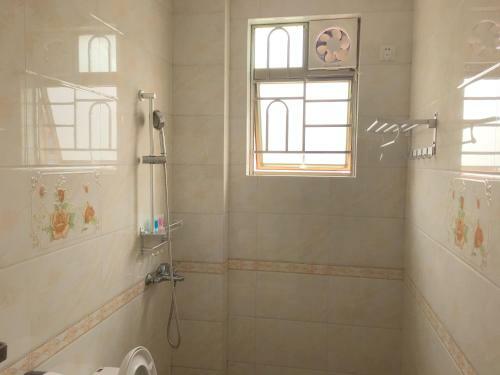 Apartamento Shuangyuewan Happy Inn