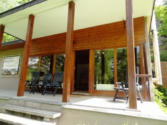 Nestled In A Green Scenery, This Chalet Along The River Is Perfect To Chill Out!