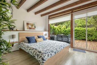 Cottage Strelitzia Among Avocados