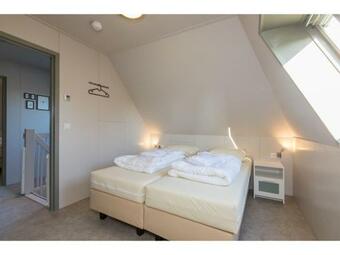 Family House On A Small Park With A Large Playing Field