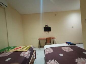 Hostal First Inn Hotel